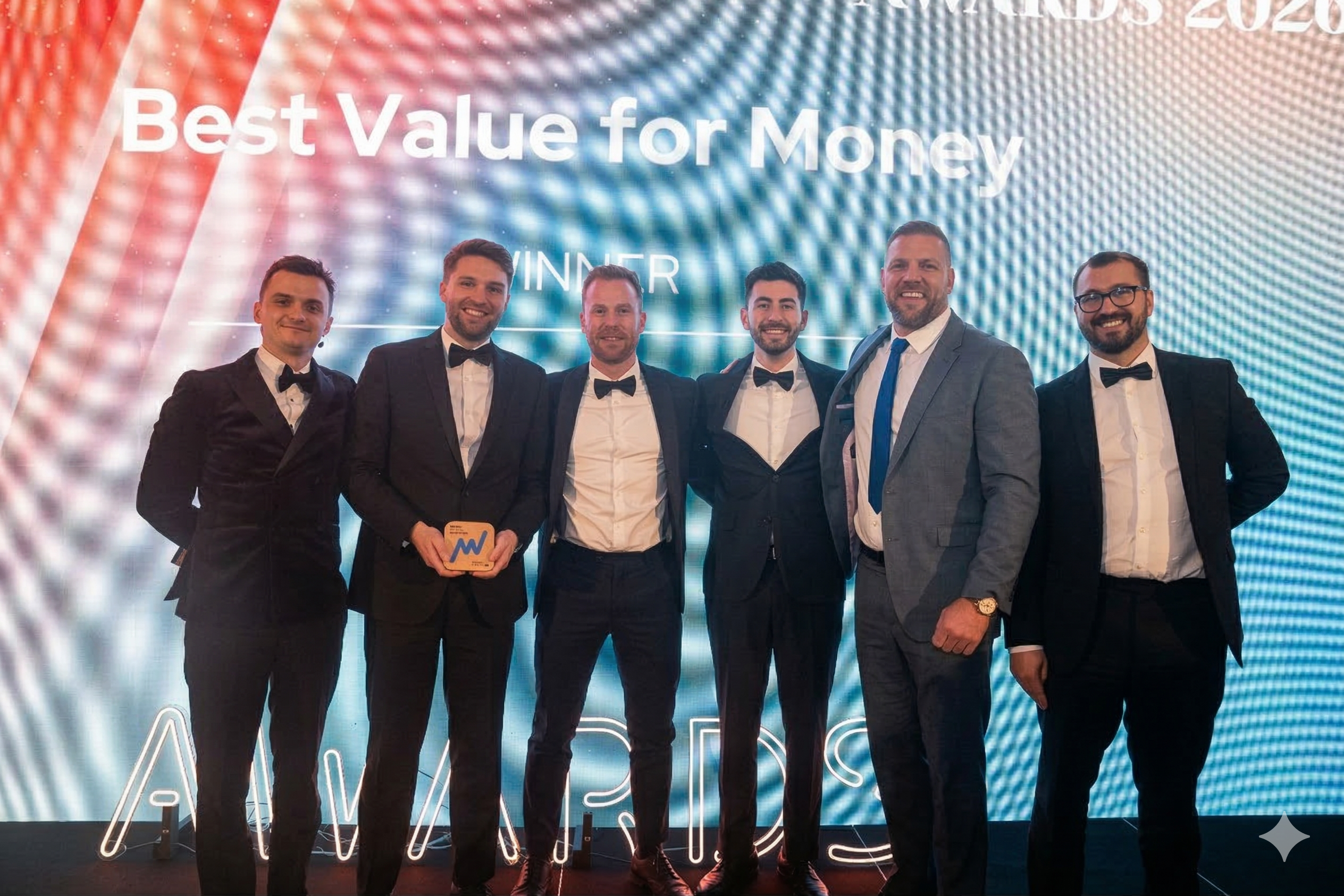 ebi's Ashley Owen and Thomas Ranft holding the Money Marketing Award