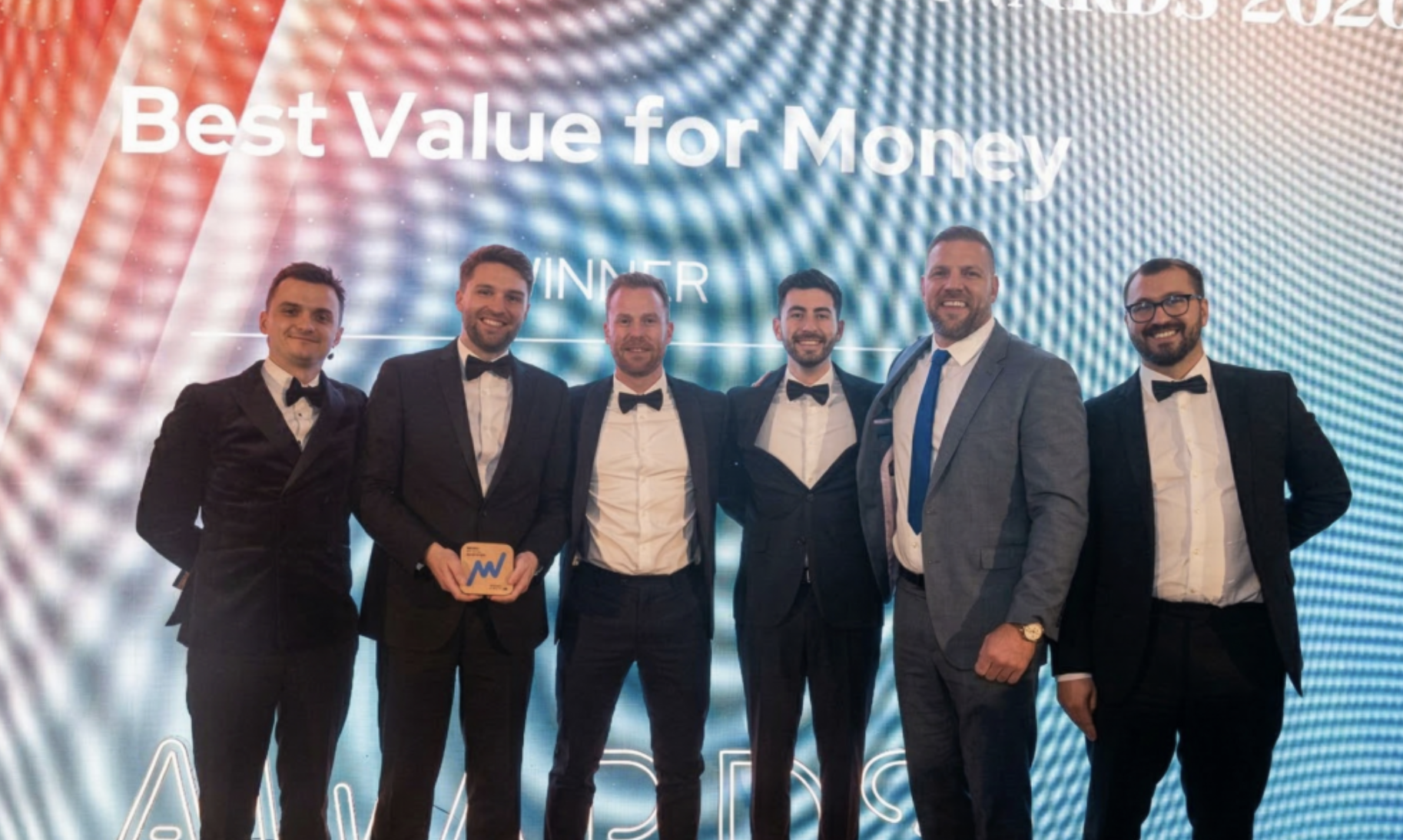 ebi's Ashley Owen and Thomas Ranft holding the Money Marketing Award